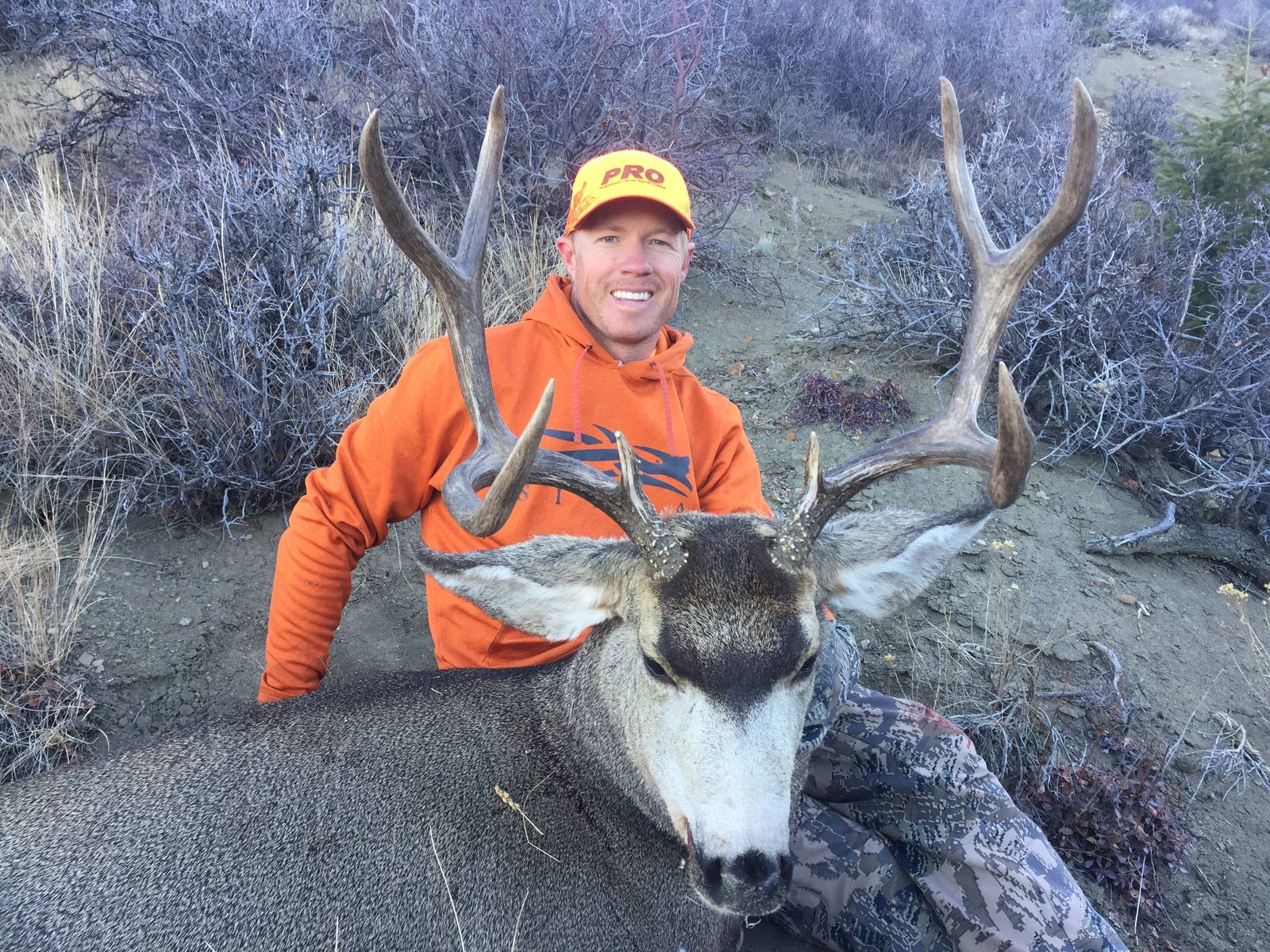 Tyce Erickson with a mule deer buck